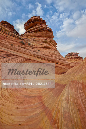 Sandstone wave and cones under clouds, Coyote Buttes Wilderness, Vermilion Cliffs National Monument, Arizona, United States of America, North America
