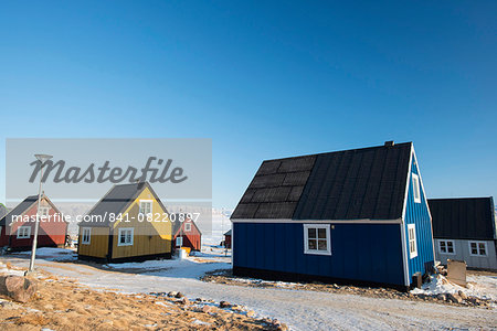 Colourful wooden houses in the village of Qaanaaq, one of the most northerly human settlements on the planet and home to 656 mostly Inuit people, Greenland, Denmark, Polar Regions