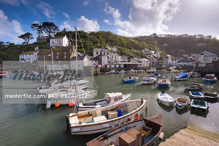 Fishing boats moored in picturesque Polperro harbour on a sunny spring evening, Cornwall, England, United Kingdom, Europe Fishing boats moored in picturesque Polperro harbour on a sunny spring evening, Cornwall, England, United Kingdom, Europe