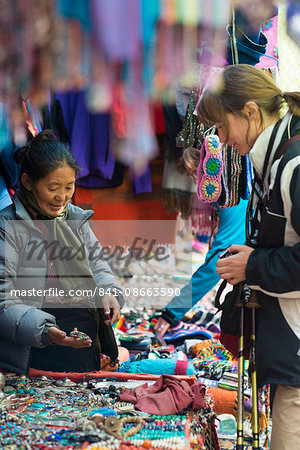 Shopping for souvenirs in Namche Bazaar, the main town during the Everest base camp trek, Nepal, Asia