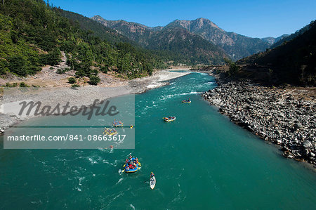 Rafts and kayaks drift down the Karnali River in west Nepal, Asia