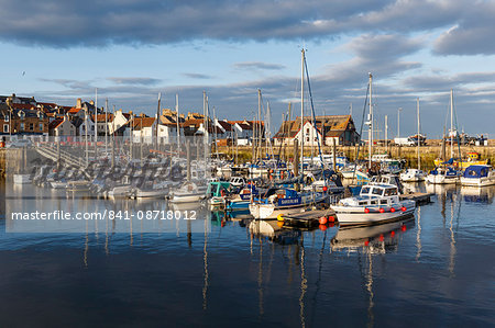 Sailing boats at sunset in the harbour at Anstruther, Fife, East Neuk, Scotland, United Kingdom, Europe