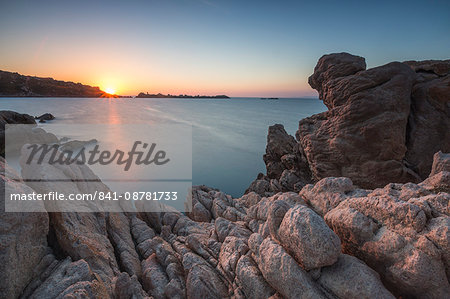 White cliffs and blue sea framed by the lights of sunset Santa Teresa di Gallura, Province of Sassari, Sardinia, Italy, Mediterranean, Europe