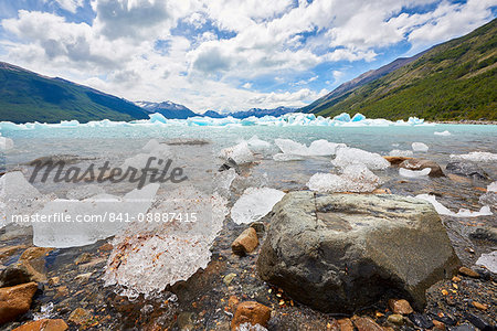 Blocks of ice float in one of the affluents of Lago Argentino, next to Perito Moreno Glacier, and wash ashore by the rocks, Los Glaciares National Park, UNESCO World Heritage Site, Patagonia, Argentina, South America Blocks of ice float in one of the affluents of Lago Argentino, next to Perito Moreno Glacier, and wash ashore by the rocks, Los Glaciares National Park, UNESCO World Heritage Site, Patagonia, Argentina, South America