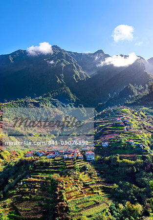 Elevated view of village and tree covered hills and mountains near Ponta Delgada, Madeira, Portugal, Atlantic, Europe