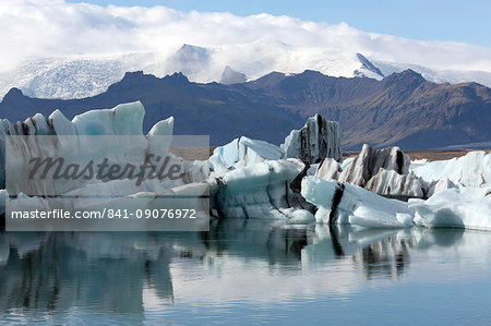 Icebergs on Jokulsarlon Glacial Lagoon, with mountains and glaciers in the background, South Iceland, Polar Regions