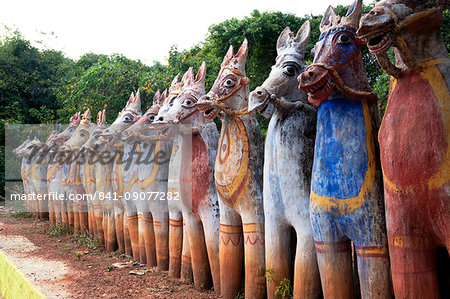 Terracotta horses, each a votive offering to village guardian deity, Ayyanar, at the Solai Andavar shrine, Palathur, Tamil Nadu, India, Asia