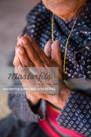Old woman's hands praying, Bhaktapur, Nepal, Asia