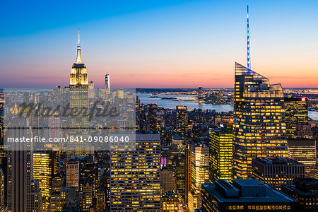 Manhattan skyline and Empire State Building at dusk, New York City, United States of America, North America