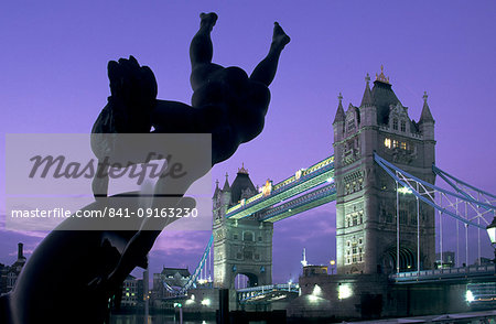 Girl with Dolphin fountain and Tower Bridge at dawn, London, England, United Kingdom, Europe