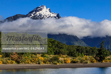 Snowy peak, lush forests, from Lake Todos Los Santos, Emerald Lake, Vicente Perez Rosales National Park, Lakes District, Chile, South America