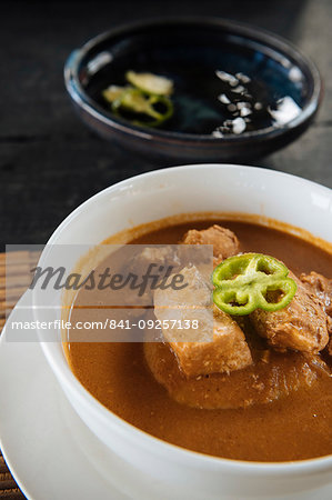 Bowl of traditional Ghanaian dish of fish soup and homemade Fufu, Busua, Ghana, Africa