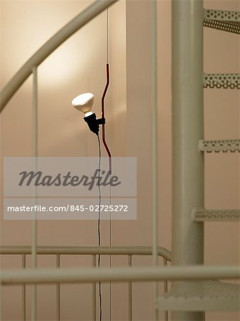 Lloret de Mar, Girona. First floor interior. Detail of spiral staircase and spotlight. Architect: Anne Bugugnani