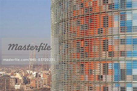 Torre Agbar, 2005, with Sagrada Familia in the background, Barcelona, Catalonia. Architects: Jean Nouvel in collaboration with b720 Arquitectura, Garcia-Ventosa Arquitectura, and Leopoldo Rodes, Arquitecto