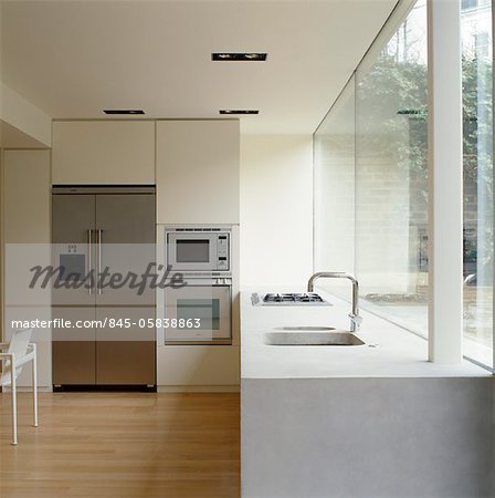 Modern kitchen with white fitted units. Architects: Found Associates