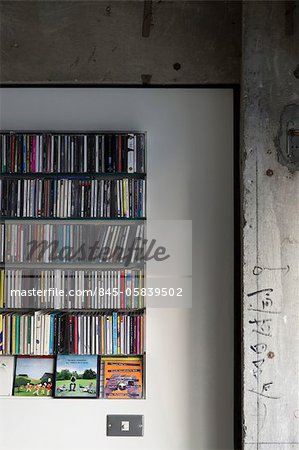 Sakura flat, Private House, Close-up of a CD shelf built into the wall. Architects: Hitoshi Wakamatsu Architect and Associates