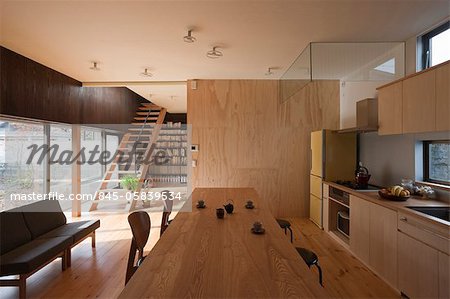 Matsugasaki-So, Apartment House, Openplan kitchen and dining room with large sliding door to living room. Architects: Dai Nagasaka, Mega