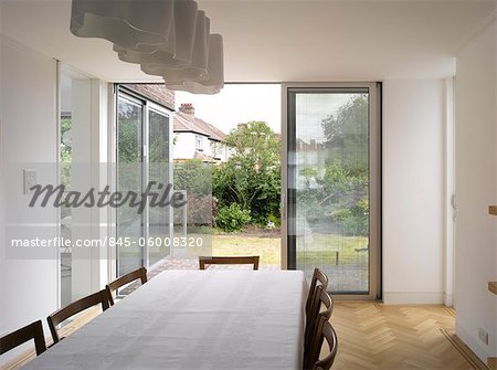 View through sliding doors from dining room of Edgware house extension, London, UK. Architects: Paul Archer Design