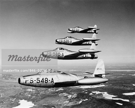 1950s FOUR US AIR FORCE THUNDER JETS IN FLIGHT FORMATION
