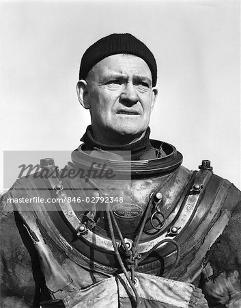 1940s DEEP WATER MARINE DIVER WEARING PRESSURE SUIT WITHOUT THE HELMET MAN PORTRAIT RUGGED ADVENTURE