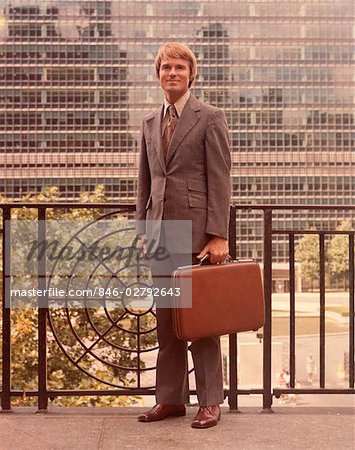 1960s FULL LENGTH PORTRAIT SALESMAN WITH BRIEFCASE