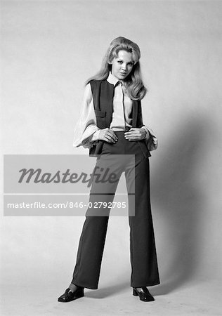 1970s PORTRAIT WOMAN WITH LONG BLOND HAIR WEARING FLARED PANTSUIT WITH VEST