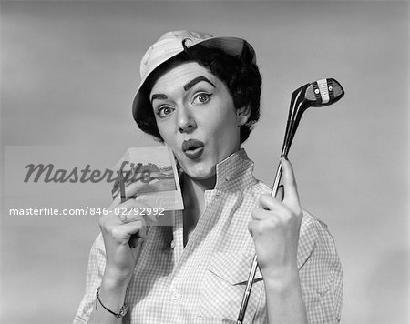 1950s WOMAN HOLDING GOLF CLUB DRIVER AND SCORE CARD & PENCIL IN OTHER HAND PAR WORRIED EXPRESSION WEARING HAT AND CHECKED BLOUSE