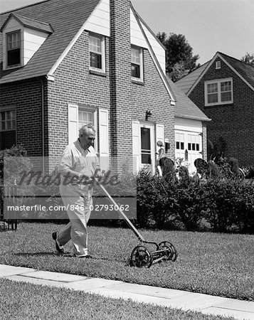 A Man Using a Push Reel Lawn Mower · Free Stock Photo