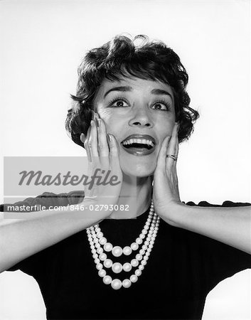 1950s 1960s WOMAN 3 STRAND NECKLACE HAND UP TO CHEEKS HAPPY SMILING ELATED JOY WIN SURPRISE FUNNY FACE EXPRESSION CHARACTER