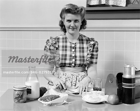 1940s WOMAN SMILING IN KITCHEN MAKING SANDWICHES FOR METAL LUNCH BOX WITH  THERMOS BOTTLE - Stock Photo - Masterfile - Rights-Managed, Artist:  ClassicStock, Code: 846-02793135