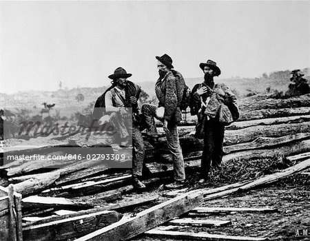 1860s CAPTURED MILITARY CONFEDERATE SOLDIERS SITTING PILE LOGS WOODEN RAILROAD TIES AMERICAN CIVIL WAR
