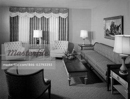 1960s FORMAL LIVING ROOM INTERIOR WITH FULL-LENGTH DRAPES PAINTING WITH ORNATE GOLD FRAME & FLOWER ARRANGEMENT ON COFFEE TABLE