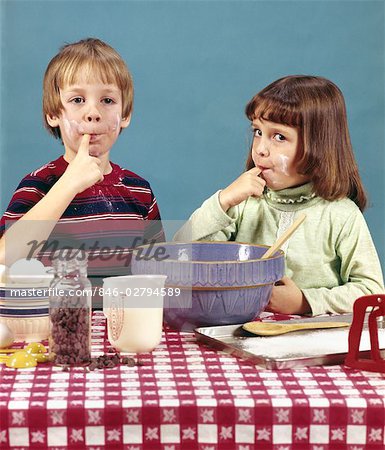 1970s RETRO BOY GIRL BROTHER SISTER MAKING COOKIES TASTING BATTER CHOCOLATE CHIPS BAKING COOKING