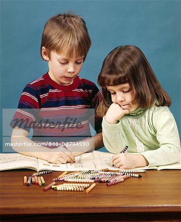 girl coloring with crayons