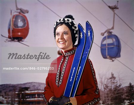 1960s 1970s SMILING WOMAN RED PONCHO BLUE SKIS SKI LIFT GONDOLA BACKGROUND