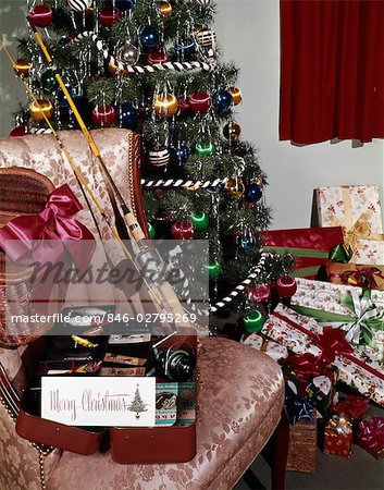 1960s CHRISTMAS TREE WITH PRESENTS FISHING POLE REEL TACKLE BOX CREEL  INDOOR STUDIO COLORFUL DECORATIONS HOBBY - Stock Photo - Masterfile -  Rights-Managed, Artist: ClassicStock, Code: 846-02795269