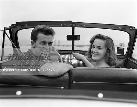 1950s CONVERTIBLE COUPLE MAN WOMAN DATE SMILE CAR