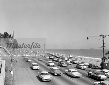 1950s 1960s HIGHWAY TRAFFIC CARS ALONG MALIBU BEACH SANTA MONICA CALIFORNIA USA TRANSPORTATION