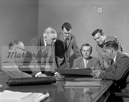 1950s GROUP OF SIX MEN AROUND A CHART