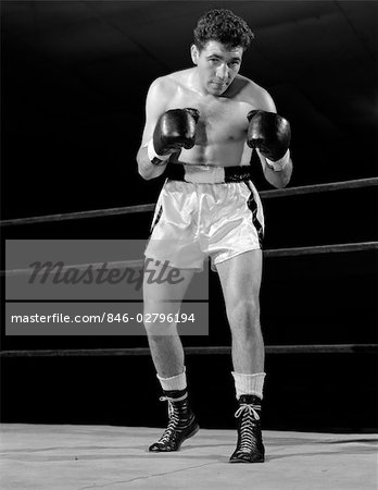 1950s FULL FIGURE BOXER IN RING FACING CAMERA WITH FISTS IN BOXING GLOVES -  Stock Photo - Masterfile - Rights-Managed, Artist: ClassicStock, Code:  846-02796194