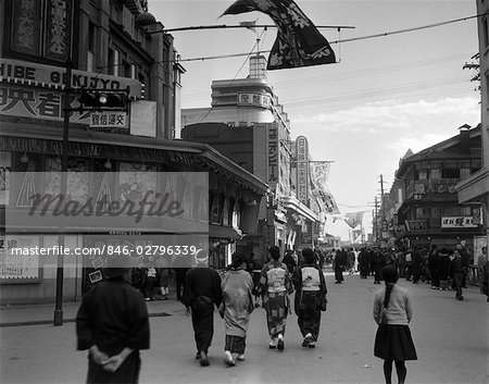 1930s PEOPLE STROLLING STREET SCENE TOKYO THEATER STREET