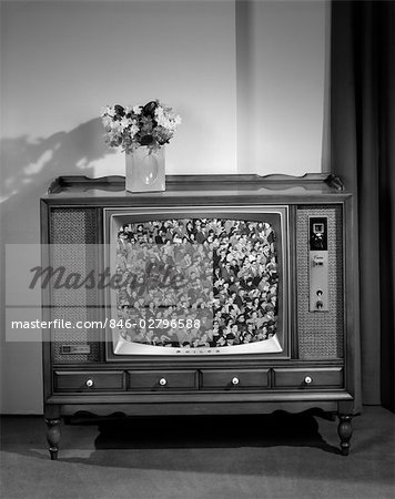 1960s HEAD-ON VIEW OF TV SET WITH CROWDS IN BLEACHERS ON SCREEN