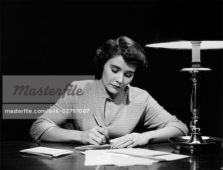 1950s Woman At Desk Writing Check Pen Lamp Finance Paying Bills