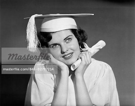 1950s GIRL WOMAN TEEN WHITE CAP GOWN HOLDING GRADUATION DIPLOMA