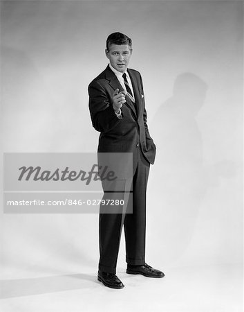 1950s Man In Business Suit Standing Pointing Finger Stock Photo Masterfile Rights Managed Artist Classicstock Code 846 02797280