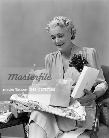 1940s ELDER WOMAN OPENING GIFT