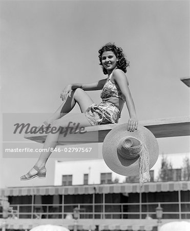 1930s 1940s WOMAN HOLDING HAT POSING DIVING BOARD SWIM SUIT POOL TRAVEL VACATION SWIMMING HOTEL MIAMI FLORIDA