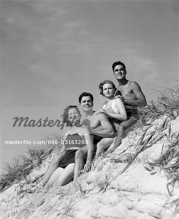 1930s GROUP YOUNG MEN WOMEN POSED ON BEACH SAND DUNE