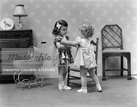 1940s TWO GIRLS PLAYING WITH DOLLS TAKING - Stock Photo - Masterfile -  Rights-Managed, Artist: ClassicStock, Code: 846-03163485