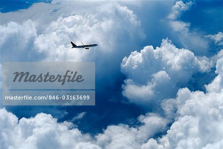 BOEING 767 FLYING THROUGH CLOUDS OVER NORTH ATLANTIC OCEAN